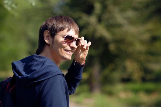 happy young man in sunglasses