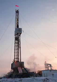 Vertical view of a drilling rig in severe winter.