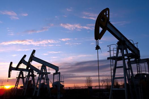 oil pumps on the sunset sky background 