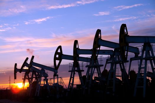 oil pumps on the sunset sky background 