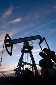 oil pumps at sunset sky  background 