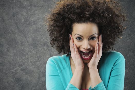 woman looks surprised and happy