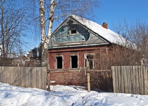 Old abandoned wooden house, winter time