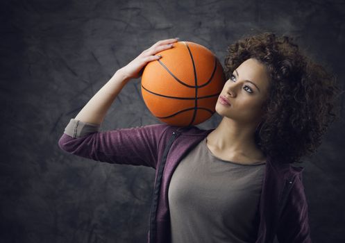 Fashion model  holding a basketball