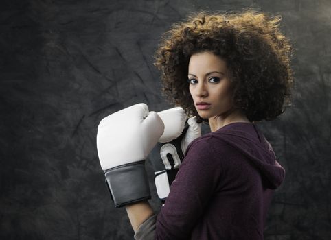 Fashion model with white boxing gloves