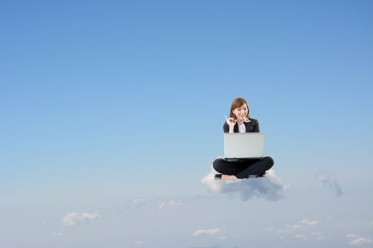 Business woman sit on cloud and use laptop over sky.