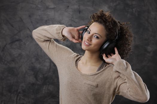 young beautiful woman enjoying music