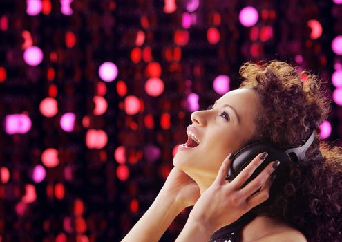 young beautiful woman enjoying music