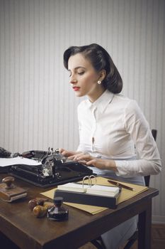 Retro business woman typing in her office