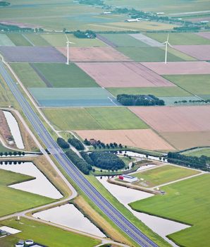 Farm landscape with windmill from above, The Netherlands