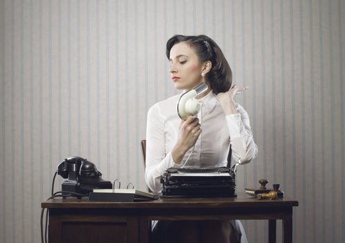 Business woman drying her hair in office