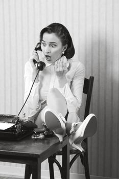 Woman talking on phone with surprised expression