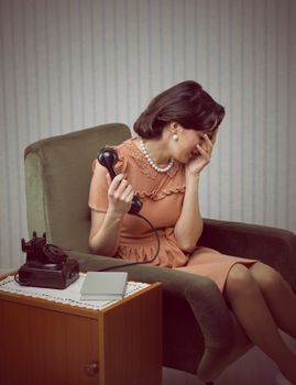 Crying woman receives a phone call with bad news