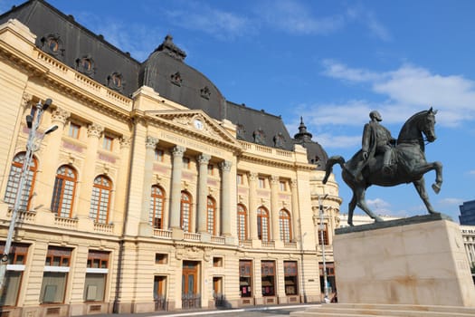 Bucharest, capital city of Romania. Central University Library and statue of king Carol I of Romania.