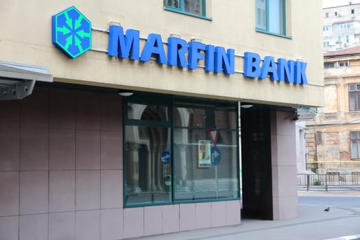 BUCHAREST, ROMANIA - AUGUST 19: Marfin Bank branch on August 19, 2012 in Bucharest, Romania. Marfin Group is one of largest companies in Greece. As of 2010 it employed 17,300 people.