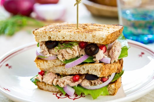 Tuna sandwich with olive and pomegranate