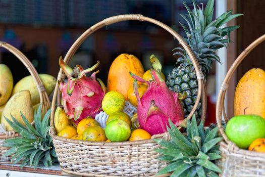 Fresh tropical fruit in a basket on a counter in the market