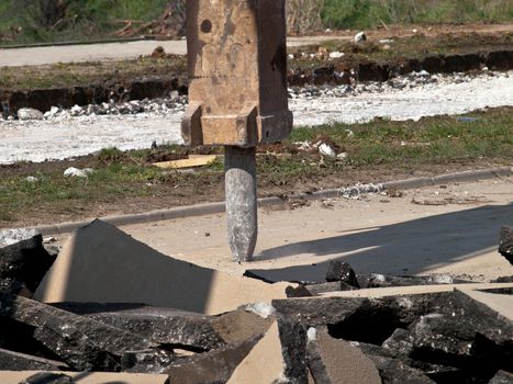 hydraulic arm of jackhammer on building site