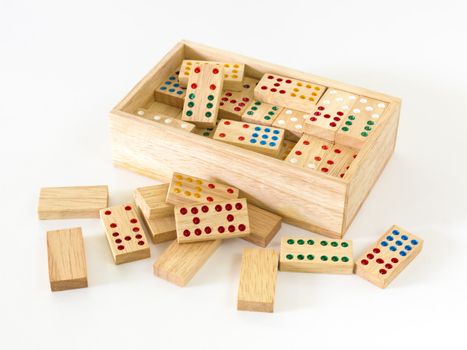 Wooden Domino in wooden box against the white background