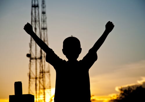 silhouette of boy happy and victory