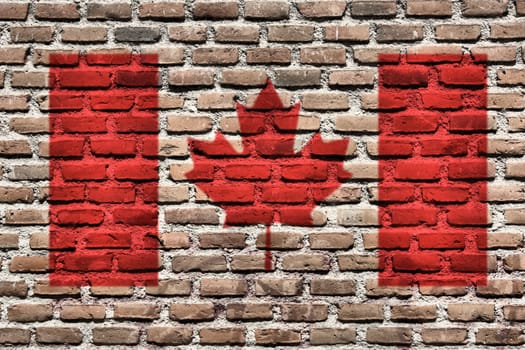 Canada national flag spray painted on a brick wall. Grunge graffiti.
