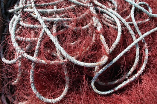 Red fishing net bundle in a harbor in Iceland