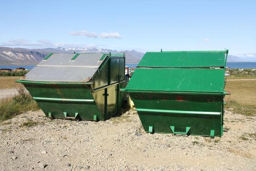 Large garbage dumpsters in Snaefellsnes peninsula, Iceland. Green refuse containers.