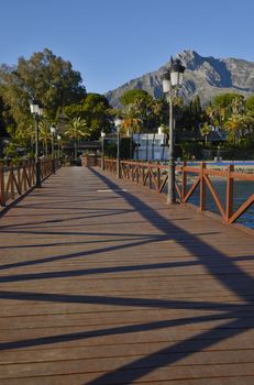 Wooden pier in the beach of Marbella, Andalusia, Spain