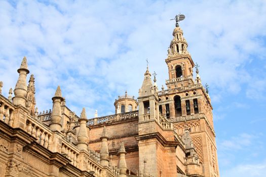 Seville in Andalusia, Spain. Giralda tower of famous cathedral. UNESCO World Heritage Site.