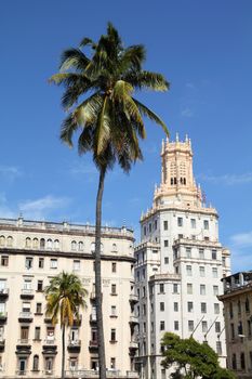 Havana, Cuba - city architecture. Eclectic buildings and palm trees.