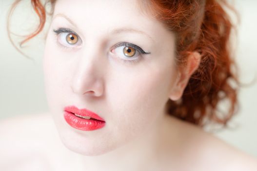 beautiful red hair and lips girl on white background