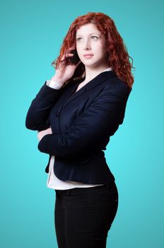 long red hair businesswoman on the phone on blue background