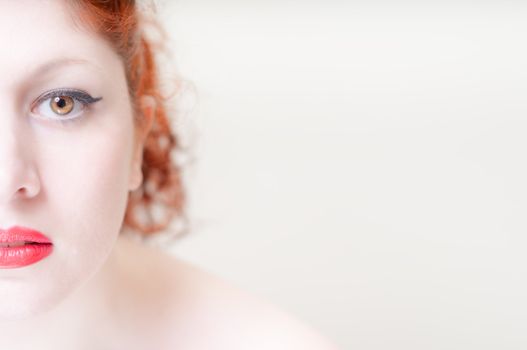 beautiful red hair and lips girl on white background