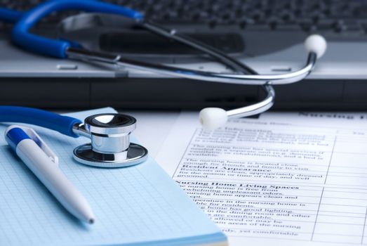 blue toned, focus point on metal part of stethoscope