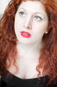 beautiful red hair and lips girl on white background