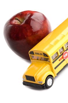 on white background, focus point on yellow bus (school)