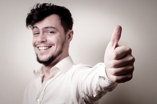 stylish modern guy with white shirt on gray background