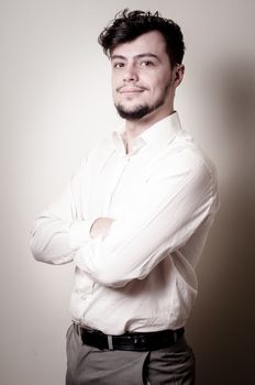 stylish modern guy with white shirt on gray background