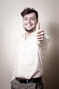 stylish modern guy with white shirt on gray background