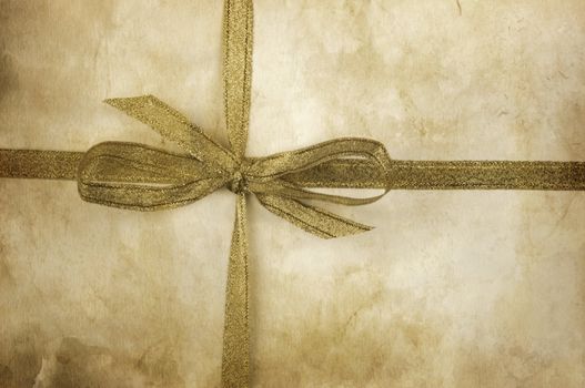 old  grunge paper texture and golden ribbon