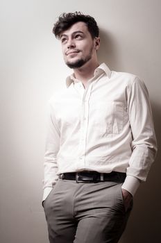 stylish modern guy with white shirt on gray background