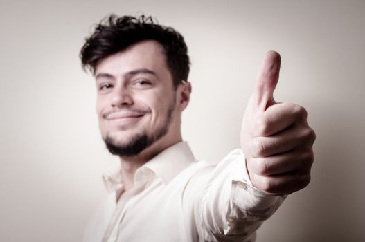 stylish modern guy with white shirt on gray background