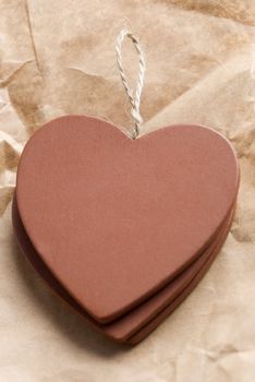 three wooden hearts, focus point on string