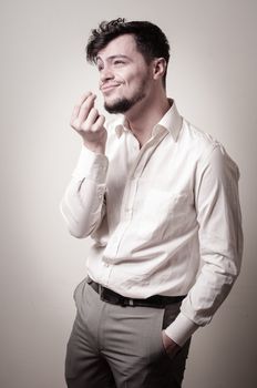 stylish modern guy with white shirt on gray background