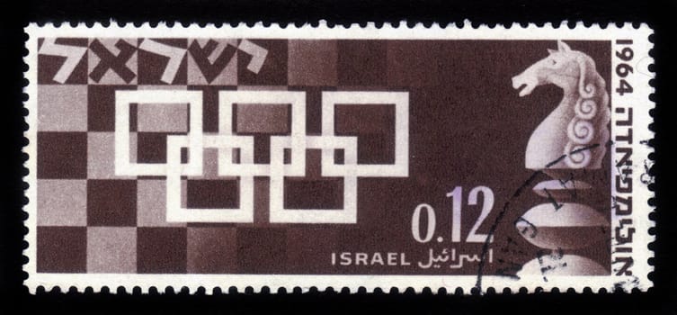 ISRAEL - CIRCA 1964: A stamp printed in Israel, shows the symbol of the chess Olympic games held in Tel-Aviv 1964, with a chess-board in the background and pieces of the game, circa 1964