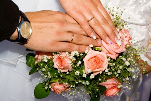 Hands on a wedding bouquet