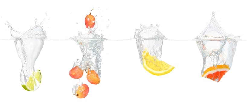 Slice of a lime, lemon, grape and grapefruit in water.