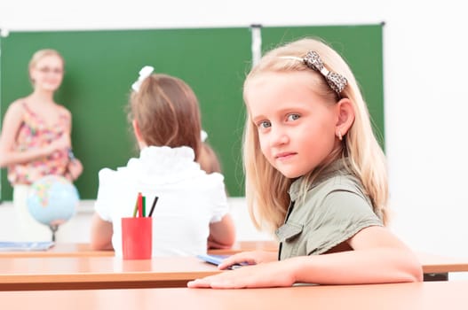 portrait of the girl in the class, the teacher tells the next school board