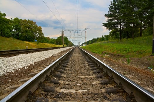 railway rails stretched afar against the sky