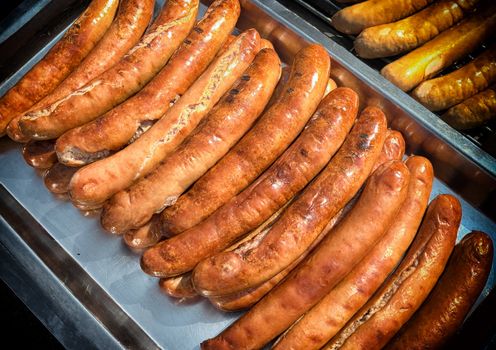 Grilled sausages on a sunny summer day.